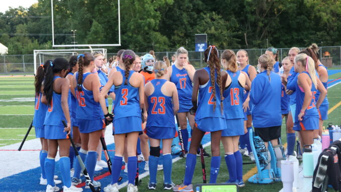 The team circles up during the final minutes of the fourth quarter.