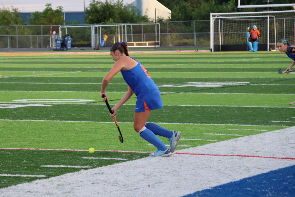Sophomore Megan Bochenek sets up to pass the ball to her teammate.